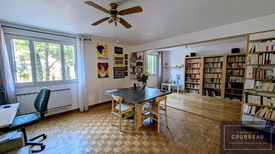 Kitchen; kitchen appliances, wood floor, natural light, modern style, renovated