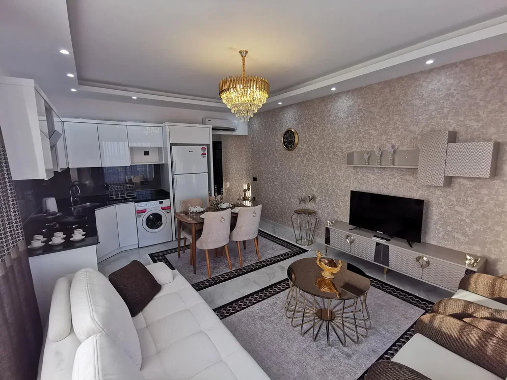 Kitchen; kitchen appliances, wood floor, natural light, modern style, renovated