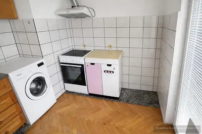 Kitchen; kitchen appliances, wood floor, natural light, modern style, renovated