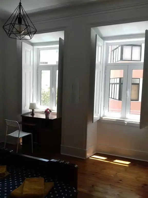 Kitchen; kitchen appliances, wood floor, natural light, modern style, renovated