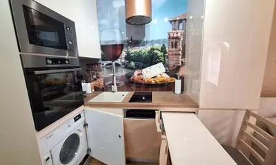 Kitchen; kitchen appliances, wood floor, natural light, modern style, renovated