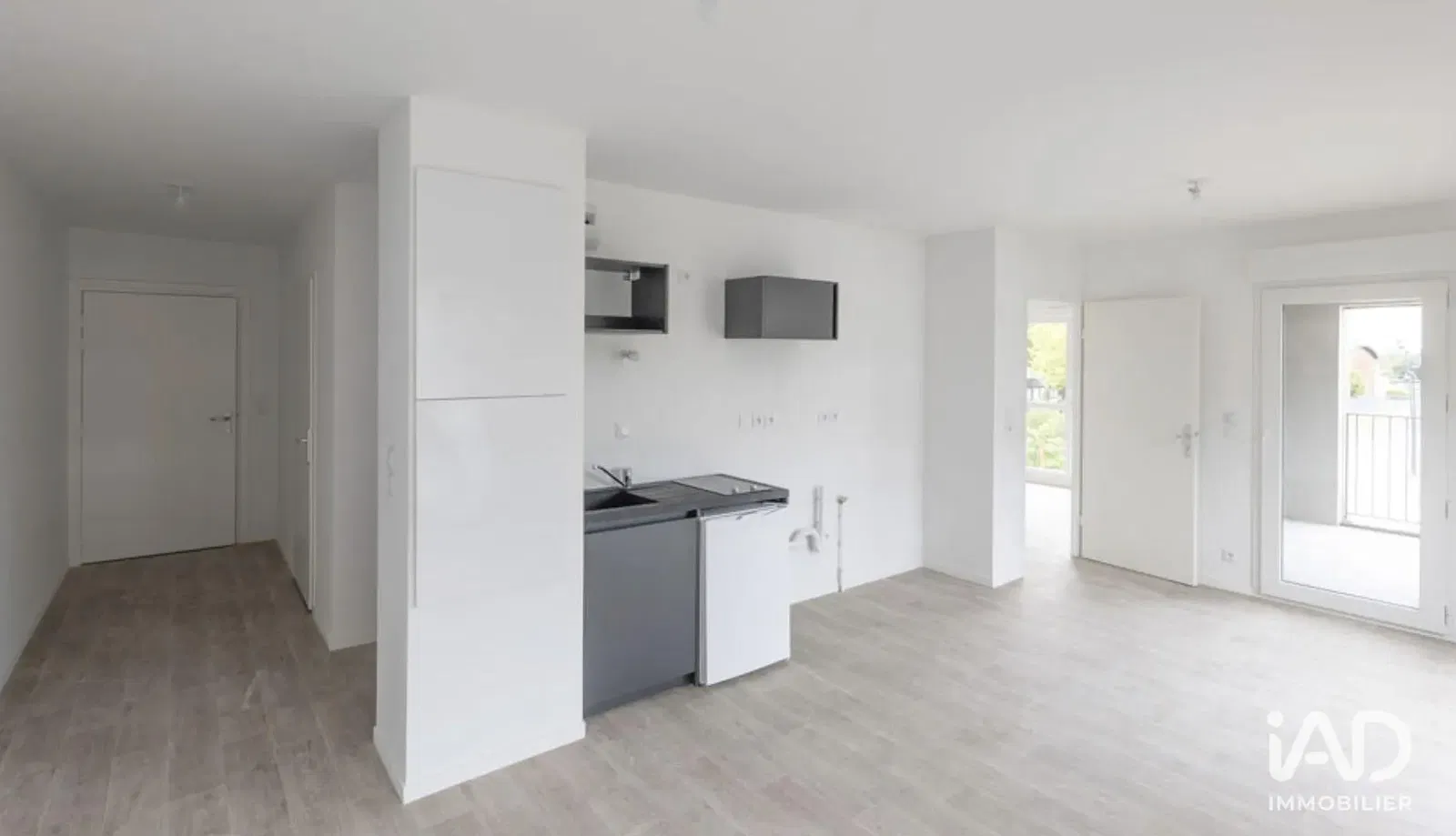 Kitchen; kitchen appliances, wood floor, natural light, modern style, renovated