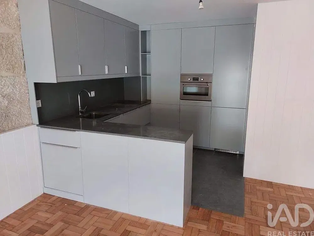 Kitchen; kitchen appliances, wood floor, natural light, modern style, renovated
