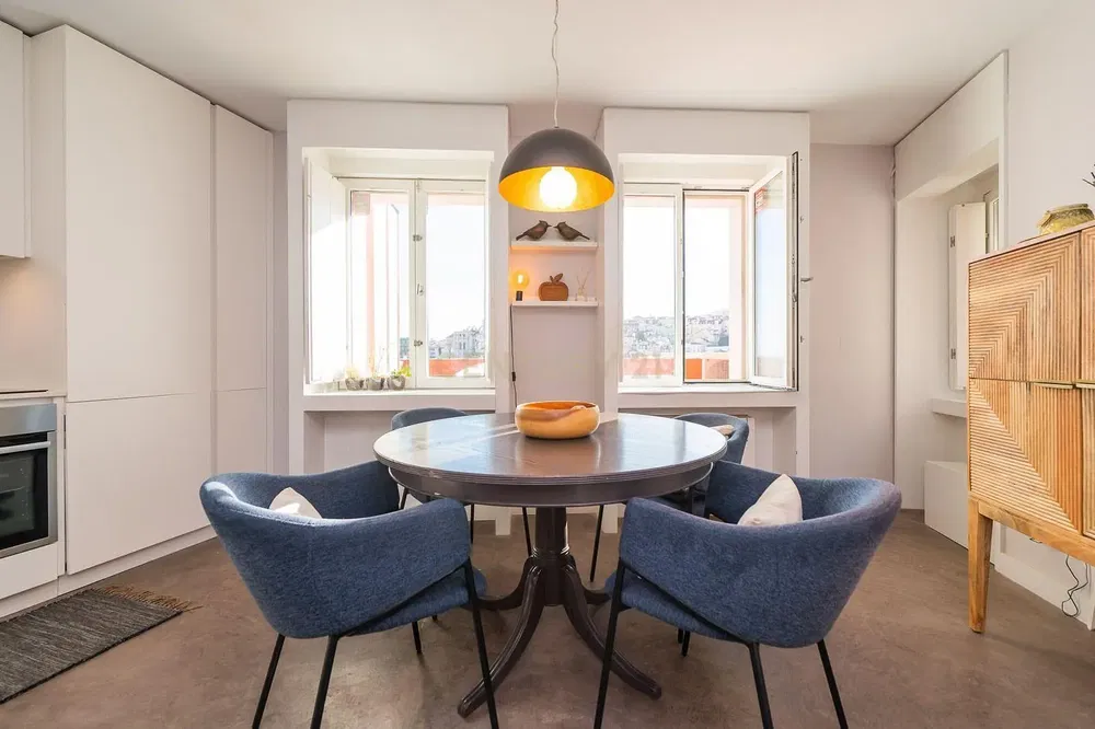 Kitchen; kitchen appliances, wood floor, natural light, modern style, renovated