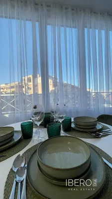 Living room; wood floor, natural light, modern style, high ceiling