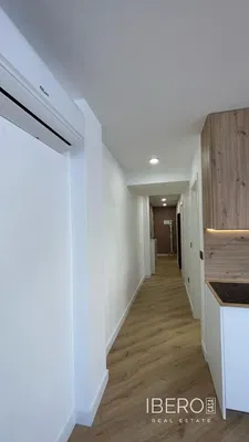 Living room; natural light, wood floor, modern style, high ceiling