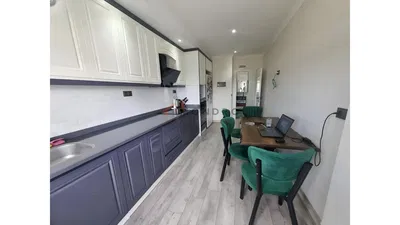 Kitchen; kitchen appliances, wood floor, natural light, modern style, renovated