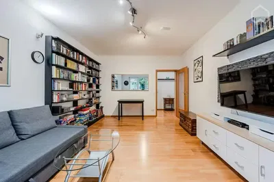 Kitchen; kitchen appliances, wood floor, natural light, modern style, renovated