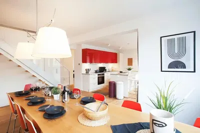 Kitchen; kitchen appliances, wood floor, natural light, modern style, renovated