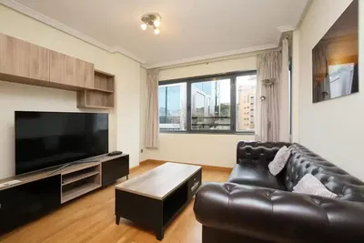 Kitchen; kitchen appliances, wood floor, natural light, modern style, renovated