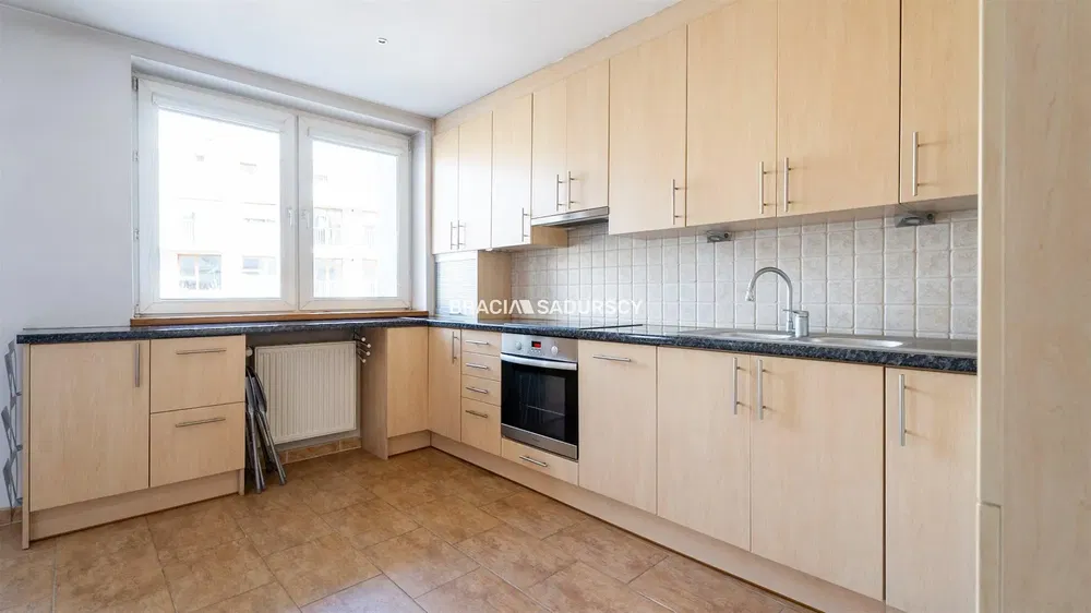 Kitchen; kitchen appliances, wood floor, natural light, modern style, renovated