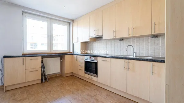 Kitchen; kitchen appliances, wood floor, natural light, modern style, renovated