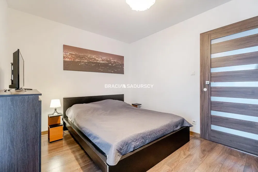 Kitchen; kitchen appliances, wood floor, natural light, modern style