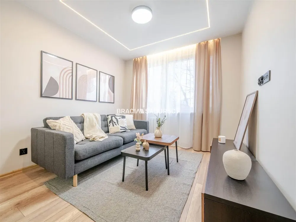 Kitchen; kitchen appliances, wood floor, natural light, modern style, renovated