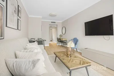 Living room; wood floor, natural light, modern style, high ceiling