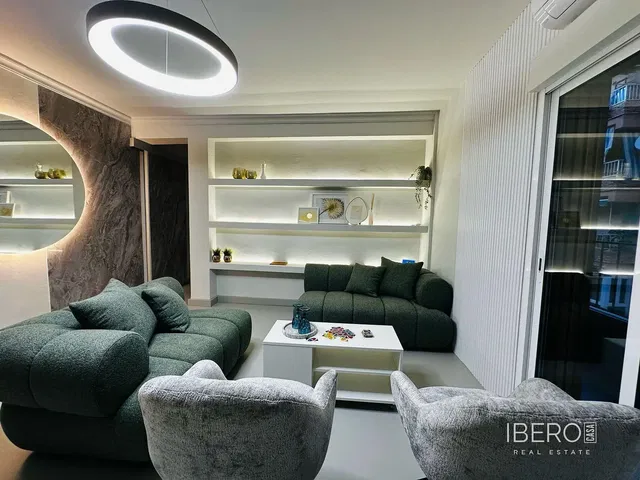 Living room; wood floor, natural light, modern style, high ceiling