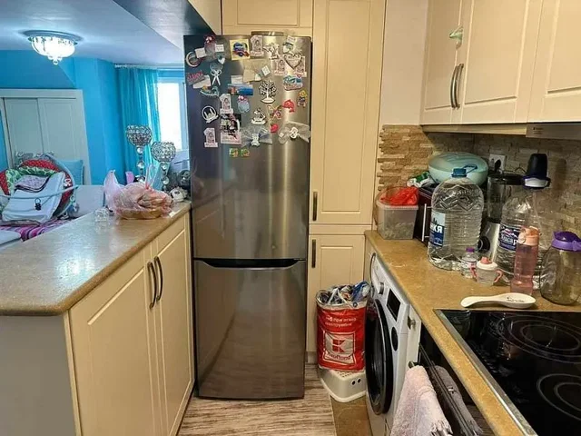 Kitchen; kitchen appliances, wood floor, natural light, modern style, renovated