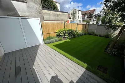 Kitchen; kitchen appliances, wood floor, natural light, modern style, renovated