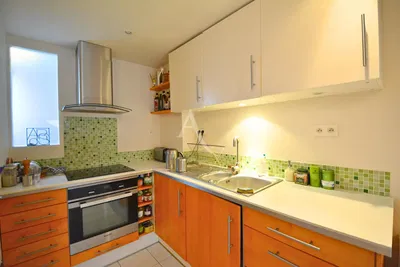 Kitchen; kitchen appliances, wood floor, natural light, modern style, renovated