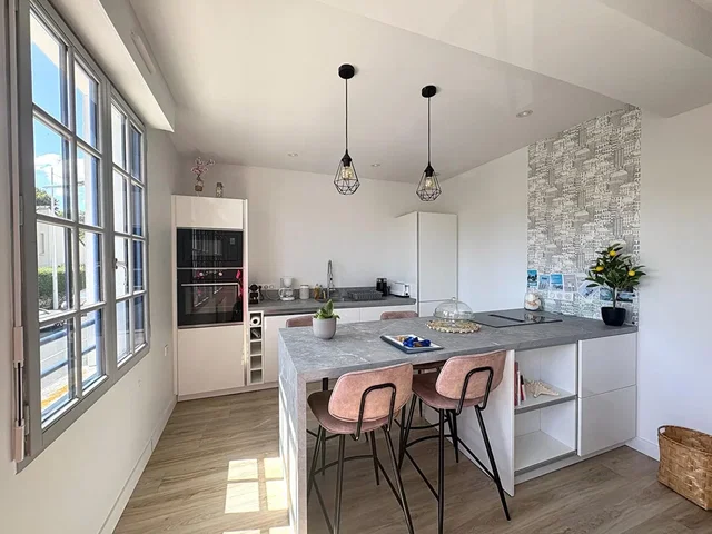 Kitchen; kitchen appliances, wood floor, natural light, modern style, renovated