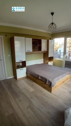 Kitchen; kitchen appliances, wood floor, natural light, modern style, renovated