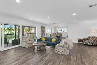 Kitchen; kitchen appliances, wood floor, natural light, modern style, renovated