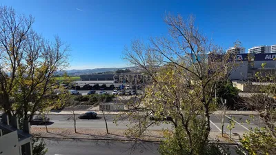 Kitchen; kitchen appliances, wood floor, natural light, modern style, renovated