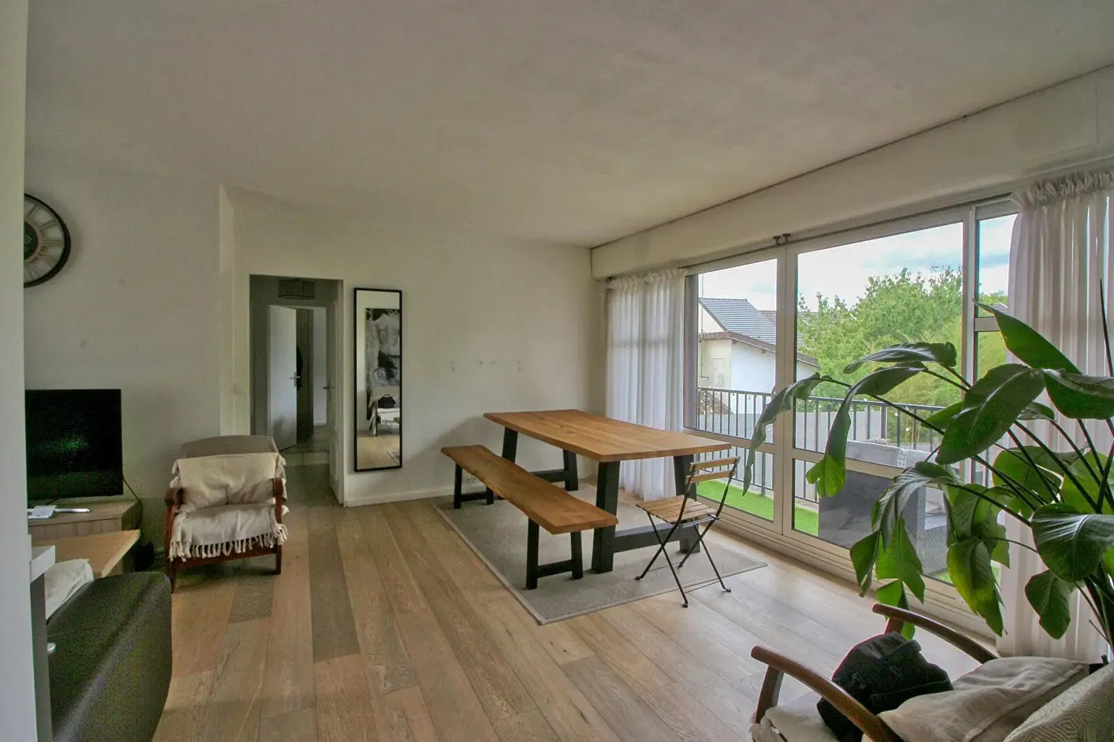 Kitchen; kitchen appliances, wood floor, natural light, modern style, renovated