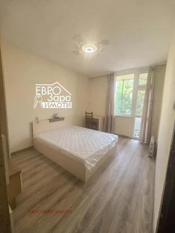 Living room; wood floor, natural light, modern style, high ceiling