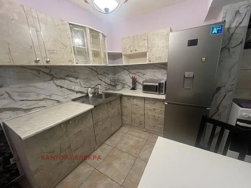 Kitchen; kitchen appliances, tile floor, natural light, modern style, renovated