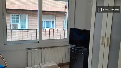 Living room; wood floor, natural light, modern style, high ceiling