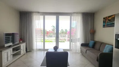 Kitchen; kitchen appliances, wood floor, natural light, modern style