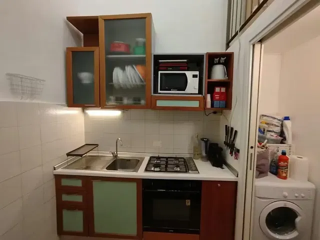 Kitchen; kitchen appliances, wood floor, natural light, modern style