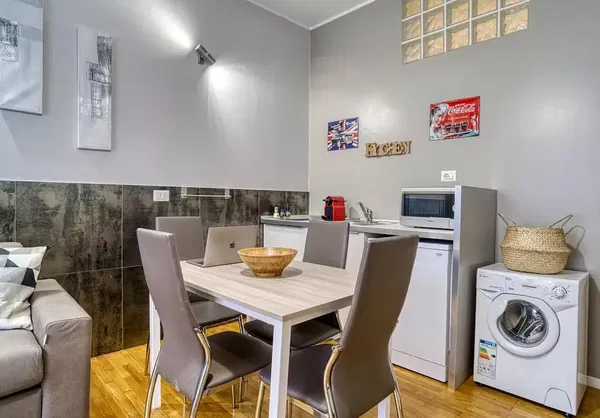 Kitchen; kitchen appliances, wood floor, natural light, modern style