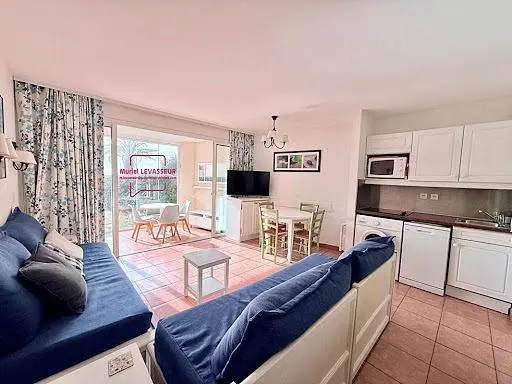 Kitchen; kitchen appliances, wood floor, natural light, modern style