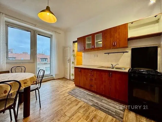 Kitchen; kitchen appliances, wood floor, natural light, modern style