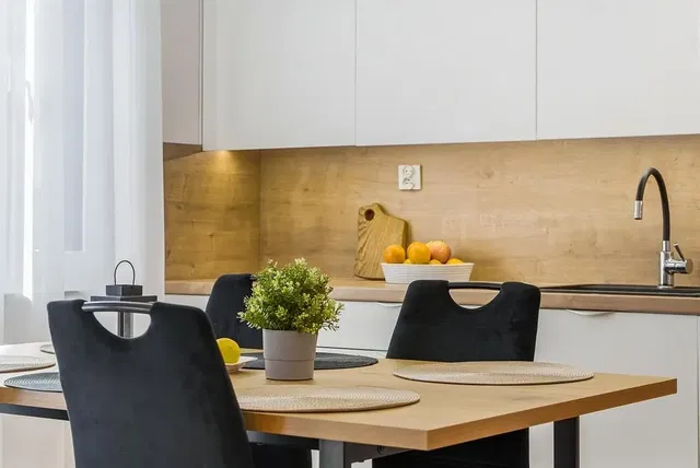 Kitchen; kitchen appliances, wood floor, natural light, modern style