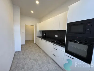 Kitchen; kitchen appliances, tile floor, natural light, modern style