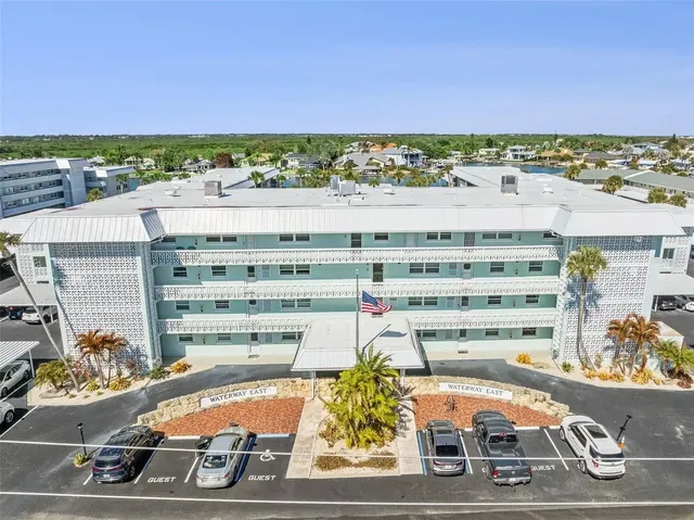 Kitchen; kitchen appliances, wood floor, natural light, modern style