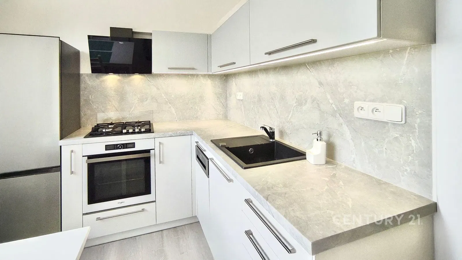 Kitchen; kitchen appliances, wood floor, natural light, modern style