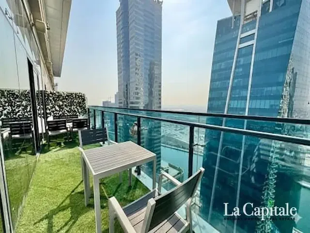 Kitchen; kitchen appliances, wood floor, natural light, modern style