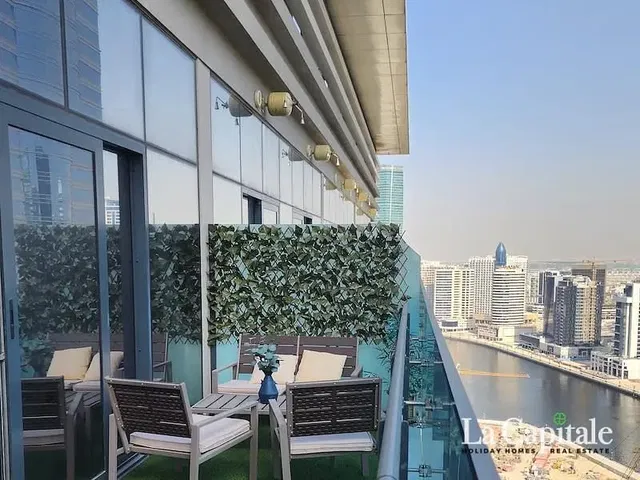 Kitchen; kitchen appliances, wood floor, natural light, modern style
