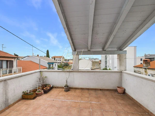 Kitchen; kitchen appliances, wood floor, natural light, modern style
