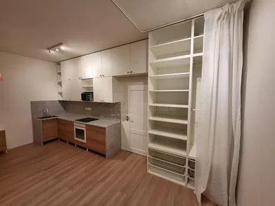 Kitchen; kitchen appliances, wood floor, natural light, modern style