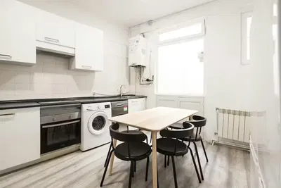 Kitchen; kitchen appliances, wood floor, natural light, modern style