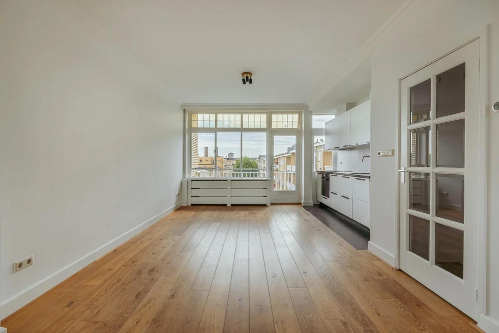 Kitchen; kitchen appliances, wood floor, natural light, modern style