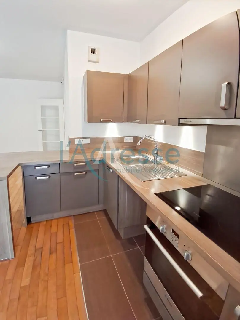 Kitchen; kitchen appliances, wood floor, natural light, modern style
