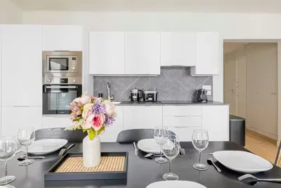 Kitchen; kitchen appliances, wood floor, natural light, modern style