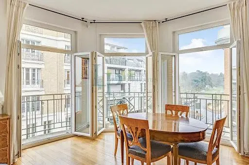 Kitchen; kitchen appliances, wood floor, natural light, modern style
