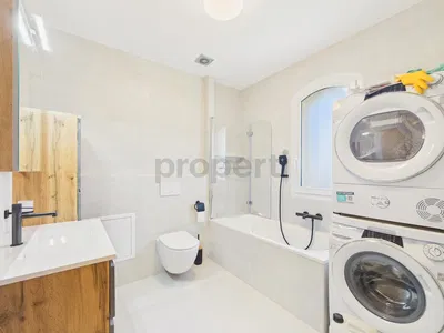 Kitchen; kitchen appliances, wood floor, natural light, modern style